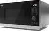 A studio shot of a silver and black Sharp microwave. Podgląd zdjęcia produktu