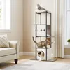 Three cats are playing on a multi-level cat tree in a living room setting. Náhled obrázku produktu