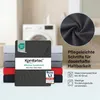 A stack of folded fitted sheets in various colors, with a washing machine in the background. Produktbild-Vorschau