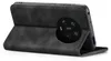 A black flip case for a smartphone, shown from the back and side. Produktbild-Vorschau