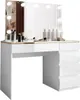 A white vanity table with a large mirror and lights, featuring makeup and skincare products on its surface. Produktbild-Vorschau