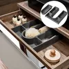 A bathroom drawer organizer with various toiletries and bath accessories. Produktbild-Vorschau