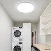 A laundry room with a stacked washer and dryer, a tall cabinet, shelves, and a workbench. Náhľad obrázku produktu