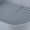 Close-up view of a gray silicone air fryer liner with raised ridges. Náhľad obrázku produktu