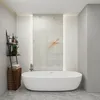 A modern bathroom with a freestanding bathtub and decorative wall paneling. Produktbild-Vorschau