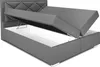 A grey upholstered bed frame with the storage compartment open, revealing the interior. Produktbild-Vorschau