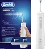 A product shot of an Oral-B AquaCare 6 Pro Expert water flosser, with the packaging on the left and the product itself on the right. The packaging shows a hand holding the device with water spraying from it, and highlights features like 'Intense Clean' and Náhľad obrázku produktu
