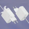 Two white power adapters are shown against a light purple background. Produktbild-Vorschau