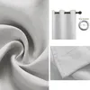 A collage showing a close-up of fabric texture, a curtain hanging on a rod with a diagram of a grommet, and a close-up of the hem of a curtain. Voir les images du produit