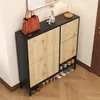 A shoe cabinet with a handbag and decorative items on top, placed in a hallway. Podgląd zdjęcia produktu