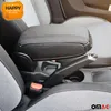 Close-up view of a car's interior, focusing on the center console with an armrest and handbrake. Anteprima dell’immagine prodotto