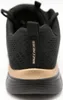 The back view of a black and gold SKECHERS sports shoe. Produktbild-Vorschau