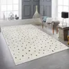 A modern living room scene with a rug as the main focus. Produktbild-Vorschau