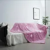A pink blanket with stars is draped over a sofa in a living room. Náhled obrázku produktu