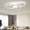 A modern living room with a sectional sofa, curtains, and a unique ceiling light. Anteprima dell’immagine prodotto