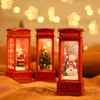 Three decorative red telephone booths with Christmas scenes inside, lit up and with a snow effect. Náhled obrázku produktu
