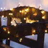 Close-up of LED string lights wrapped around wooden beams. Produktbild-Vorschau