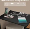 A charging station with a phone, watch, and tablet on a black desk. Produktbild-Vorschau