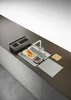 A modern kitchen sink setup with various accessories. Voir les images du produit