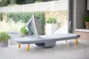 A compact ironing board with an iron on top, set on a countertop with a blurred outdoor background. Náhľad obrázku produktu