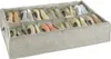 A shoe organizer with multiple compartments filled with shoes. Náhled obrázku produktu