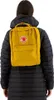 A person wearing a black jacket and a yellow backpack. Anteprima dell’immagine prodotto