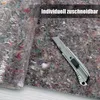 A roll of painter's fleece is partially unrolled, with a utility knife placed on it, suggesting it is cuttable. Produktbild-Vorschau