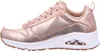 A side view of a single rose gold sneaker against a white background. Voir les images du produit