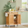 A kitchen scene with a wooden kitchen cart, green cabinets, and a window. Produktbild-Vorschau