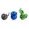 Three Bakugan toys are displayed in their spherical form, with one partially transformed. Podgląd zdjęcia produktu