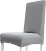 A gray chair cover on a white chair. Náhled obrázku produktu