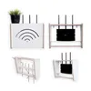 A collage of four images showing different angles and configurations of a router storage box, some with routers inside and one with a plant on top. Anteprima dell’immagine prodotto