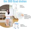 A woman in a bathrobe is sitting on a shower stool in a bathroom, with diagrams showing how to rotate the stool. Produktbild-Vorschau