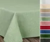 A close-up of a light green tablecloth with a linen-like texture, draped over a table. To the right, a vertical strip displays swatches of various tablecloth colors. Produktbild-Vorschau