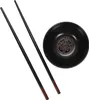 A black bowl with a decorative pattern inside and two black chopsticks with brown tips, arranged on a white background. Náhled obrázku produktu