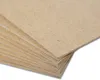 A stack of thin, light brown MDF boards. Produktbild-Vorschau