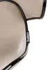 A close-up of a beige bar stool with a black trim and a black label with the brand name 'Beliani' on it. Náhled obrázku produktu