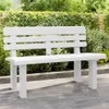A white garden bench is placed on a paved patio in front of a green hedge. Anteprima dell’immagine prodotto