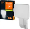 A white LEDVANCE floodlight with a motion sensor is shown next to its packaging. Voir les images du produit