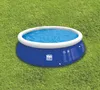 An inflatable pool filled with water sits on a grassy lawn. Produktbild-Vorschau