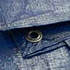 A close-up view of a blue tarp with a metal grommet. Produktbild-Vorschau