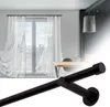 A collage showing a curtain rod in the foreground and a room with curtains and a table in the background. Anteprima dell’immagine prodotto