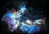 A string of butterfly-shaped lights illuminated in various colors against a dark background. Produktbild-Vorschau