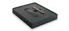A black box with a black insert holding a bronze pen and a black accessory. Voir les images du produit