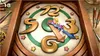 A clock face with cartoon characters on the hour hand. Produktbild-Vorschau