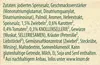 A close-up of text on a light tan background, likely from product packaging. Anteprima dell’immagine prodotto