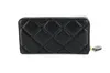A black quilted wallet is shown against a white background. Produktbild-Vorschau
