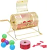 A golden lottery drum with red tickets inside, along with several colored balls and a roll of tickets, is displayed against a white background. Náhled obrázku produktu