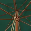 Close-up view of the internal structure of a green umbrella, showing the wooden mast and spokes. Náhled obrázku produktu