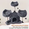 A multi-level cat tree with platforms, a hideaway, and dangling toys, presented against a plain background with overlaid text. Podgląd zdjęcia produktu